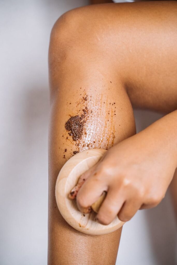 Detailed shot of a person applying exfoliating scrub to their skin for smoothness.